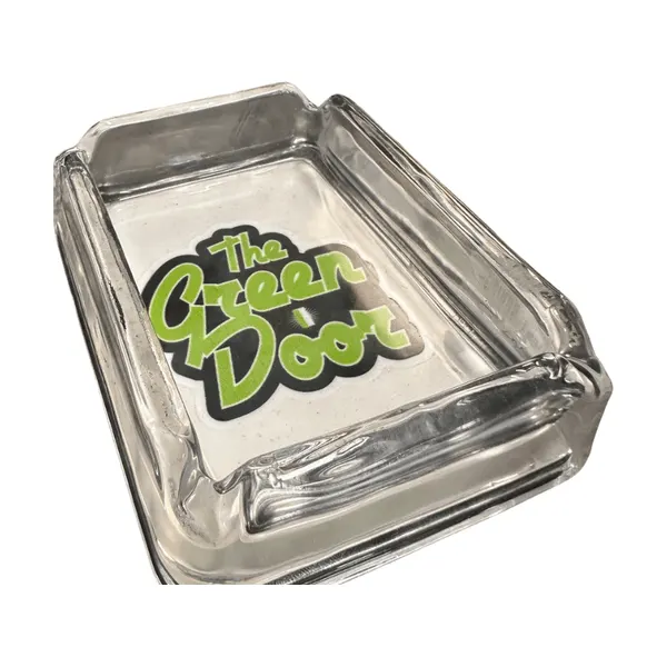 Glass ashtray with The Green Door logo